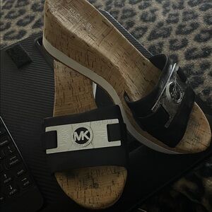 Michael Kors Black Slide Sandals with Silver MK Plaque